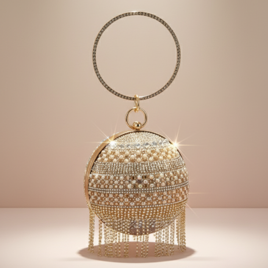 Dazzle Dome clutch in golden ball shape with luxury finish by The Silken Chic