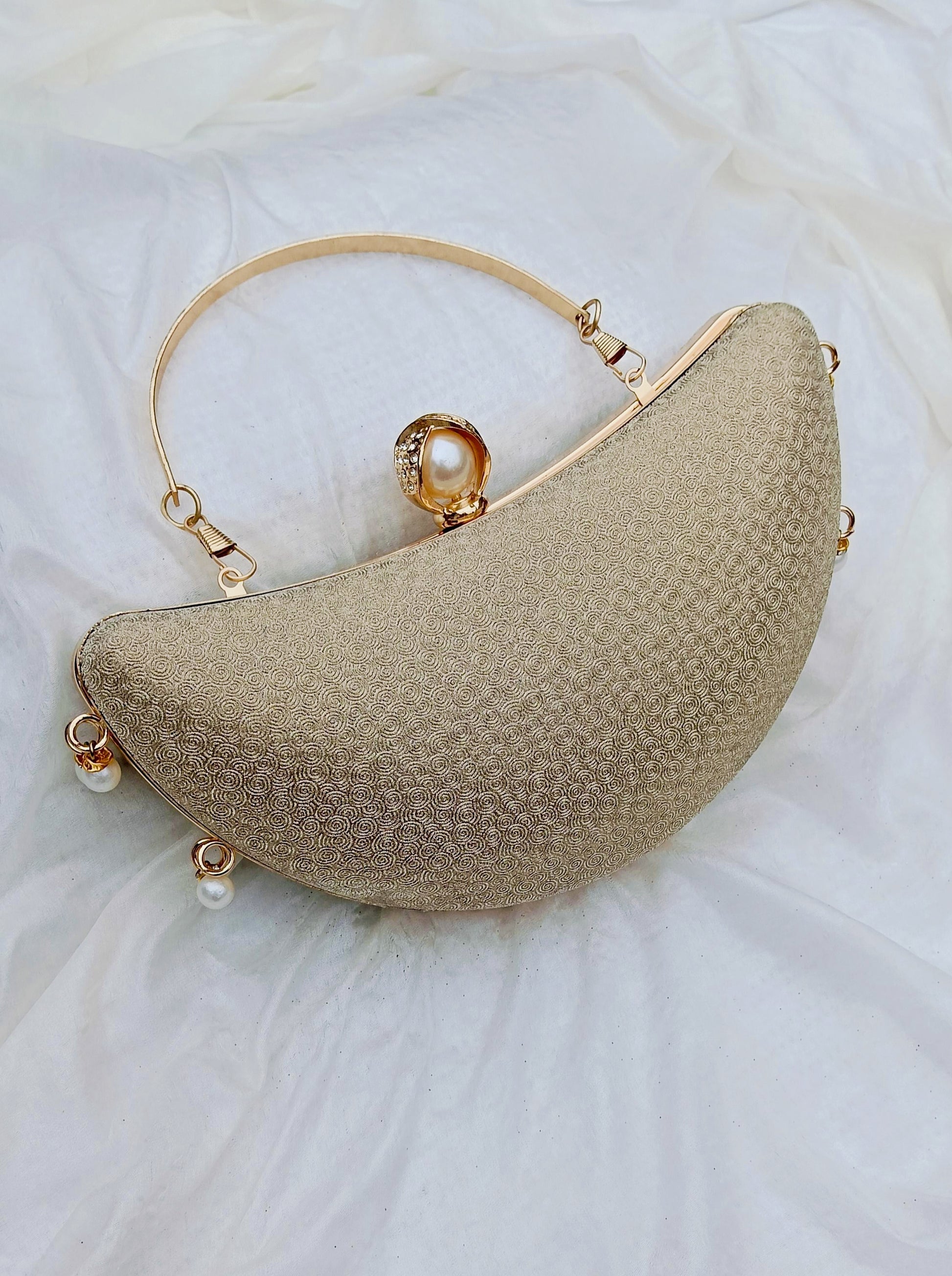 Noor Crescent clutch in gold with elegant half-moon design, night party clutch by The Silken Chic