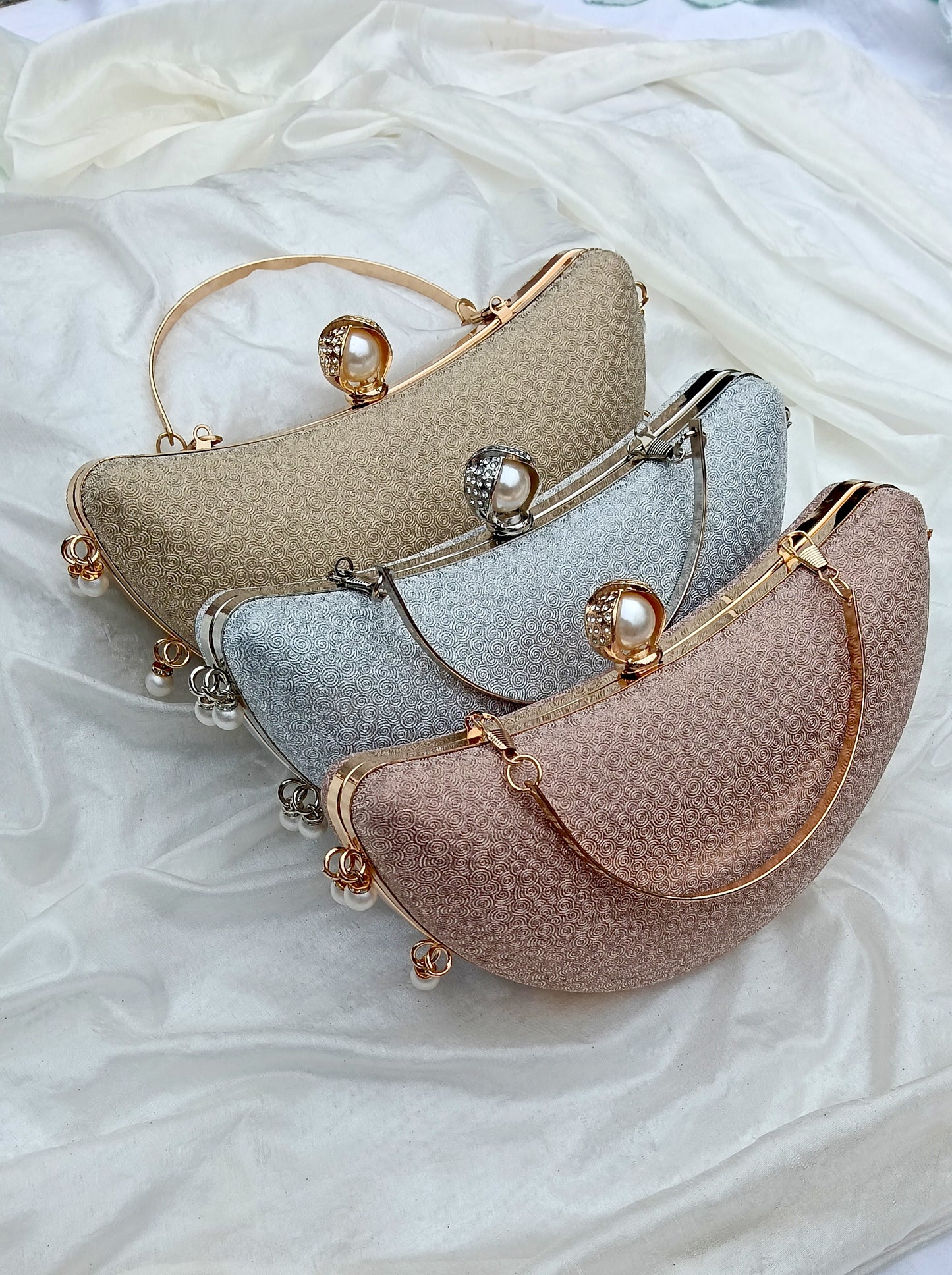 Noor Crescent clutch in gold, silver & pink with elegant half-moon design, wedding clutch by The Silken Chic