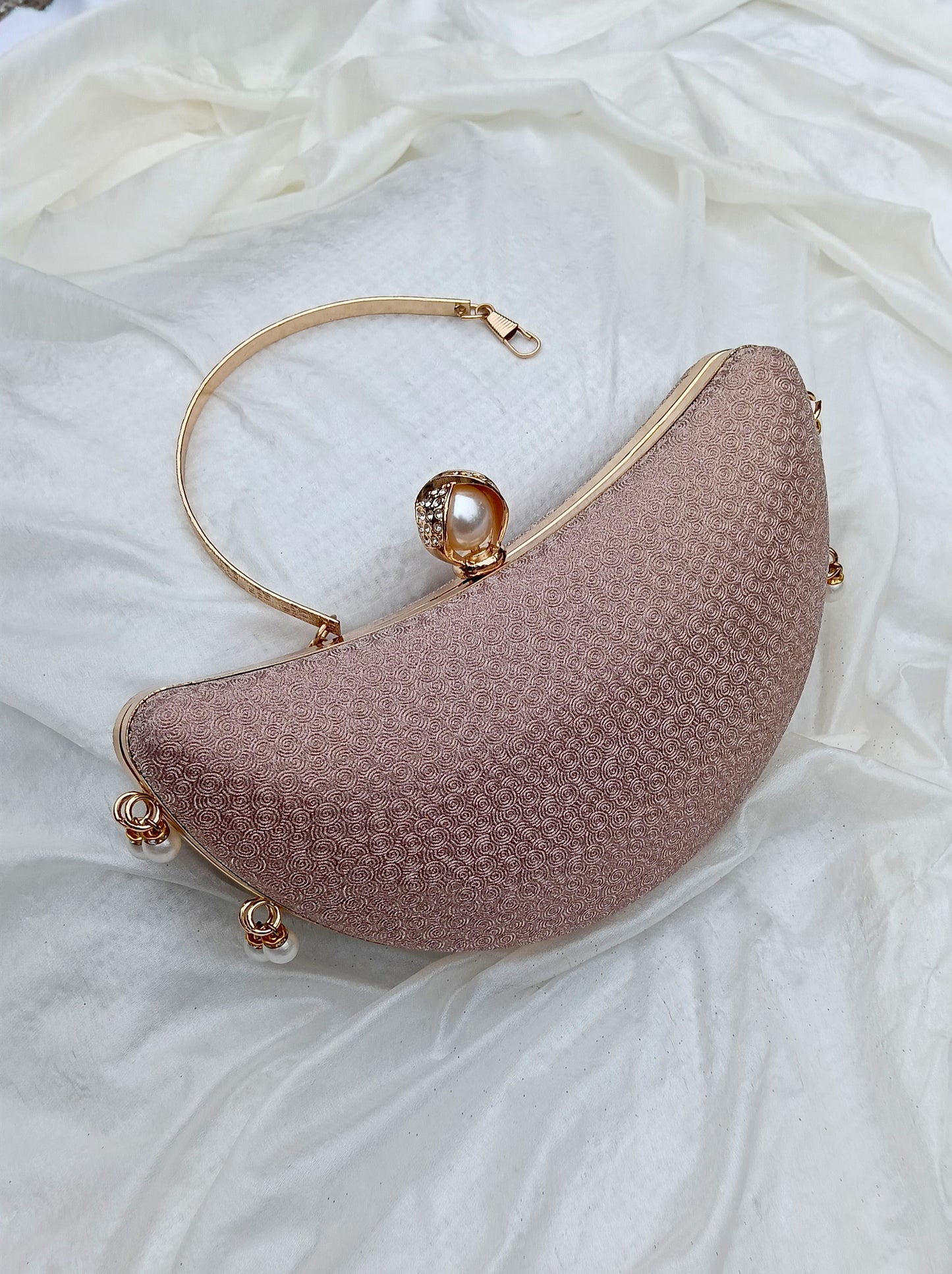 Noor Crescent clutch in pink with elegant half-moon design, evening clutch by The Silken Chic